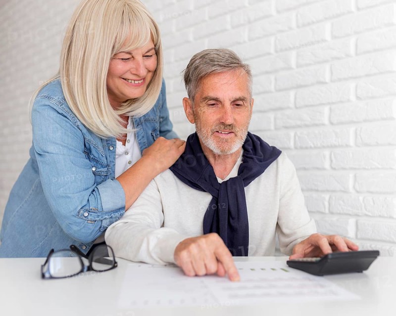 Medium shot couple looking document