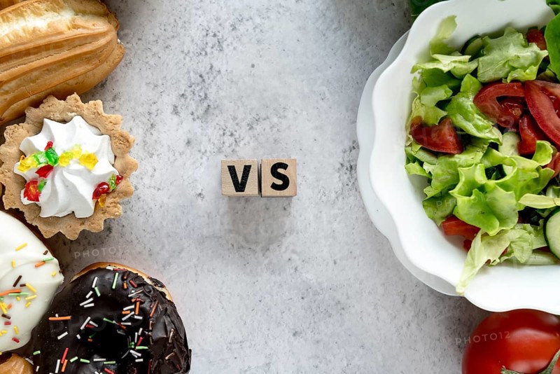 High angle view healthy vs unhealthy food concrete background