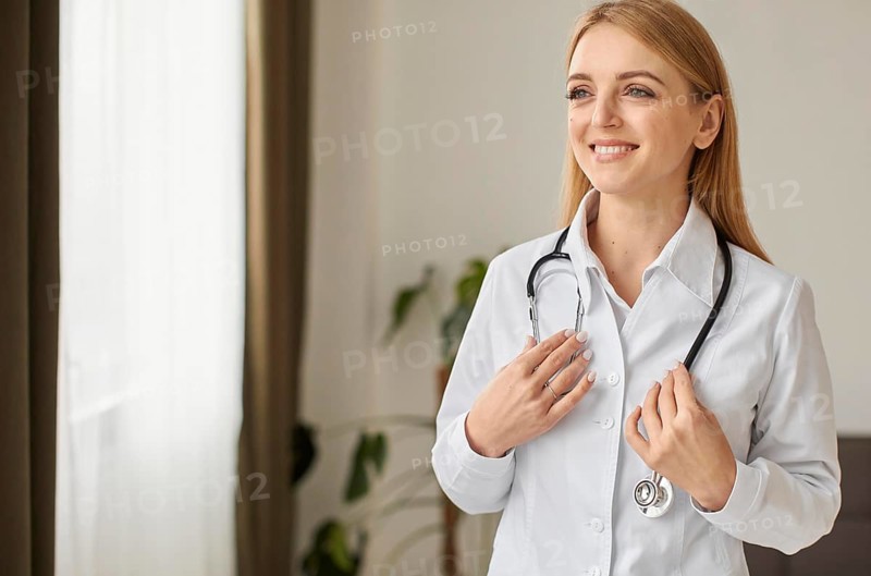 Front view smiley covid recovery center female doctor with stethoscope