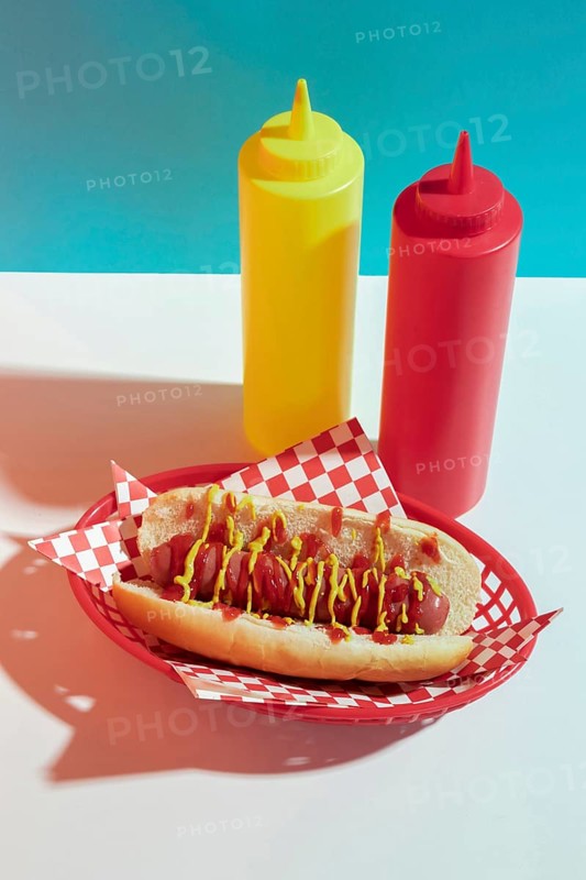 High angle arrangement with hot dog sauce bottles