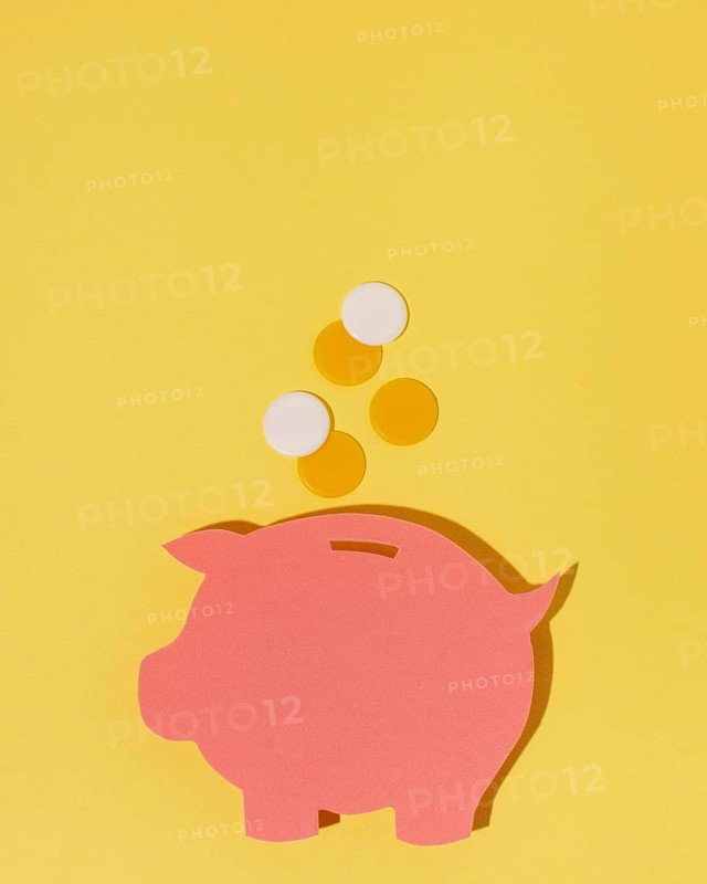 Top view piggy bank yellow background