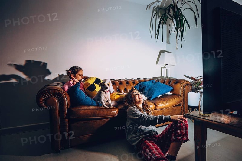 Teen girls watching comedy dark