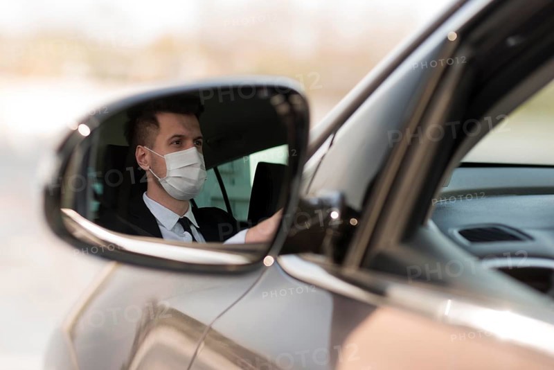 Man car mirror with mask