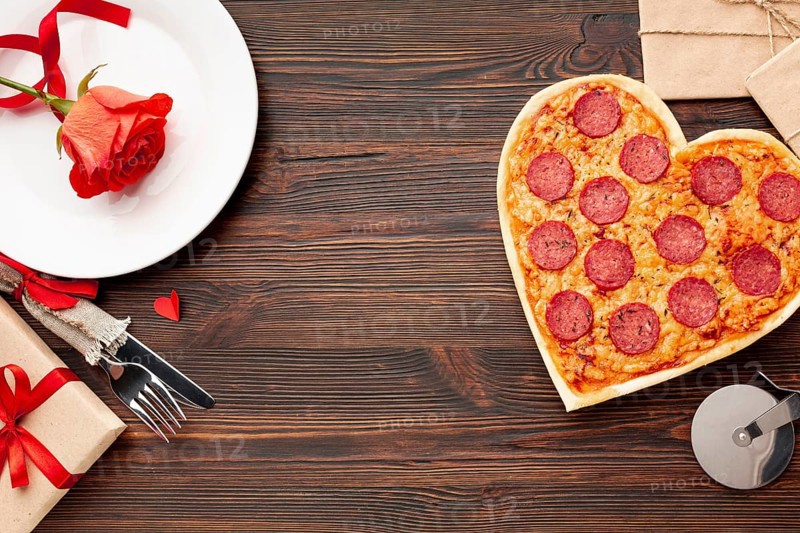 Lovely arrangement valentines day dinner with heart shaped pizza
