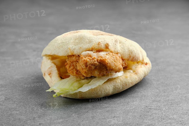 Flat bread with chicken fillet in breading