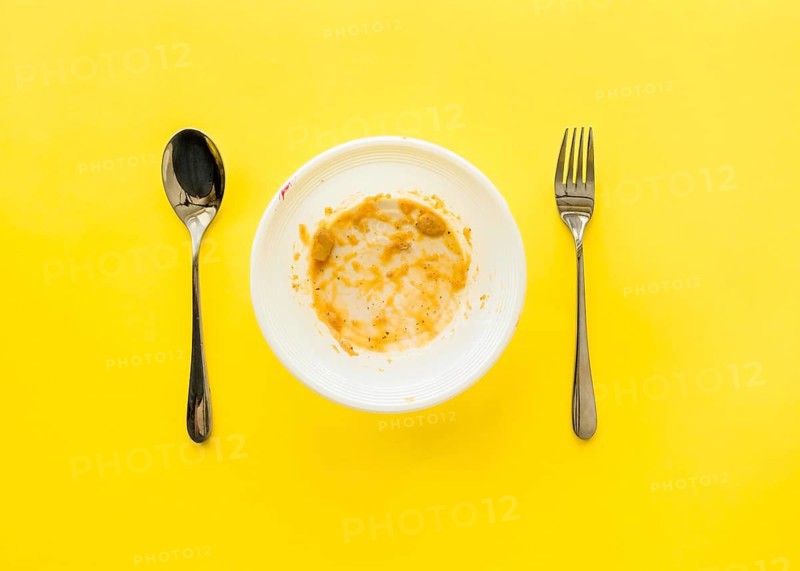 Top view dirty plate with cutlery table