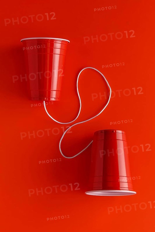 Top view two paper cups with string