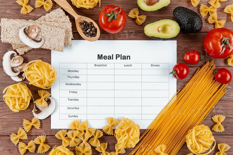 Top view meal plan with pasta avocado