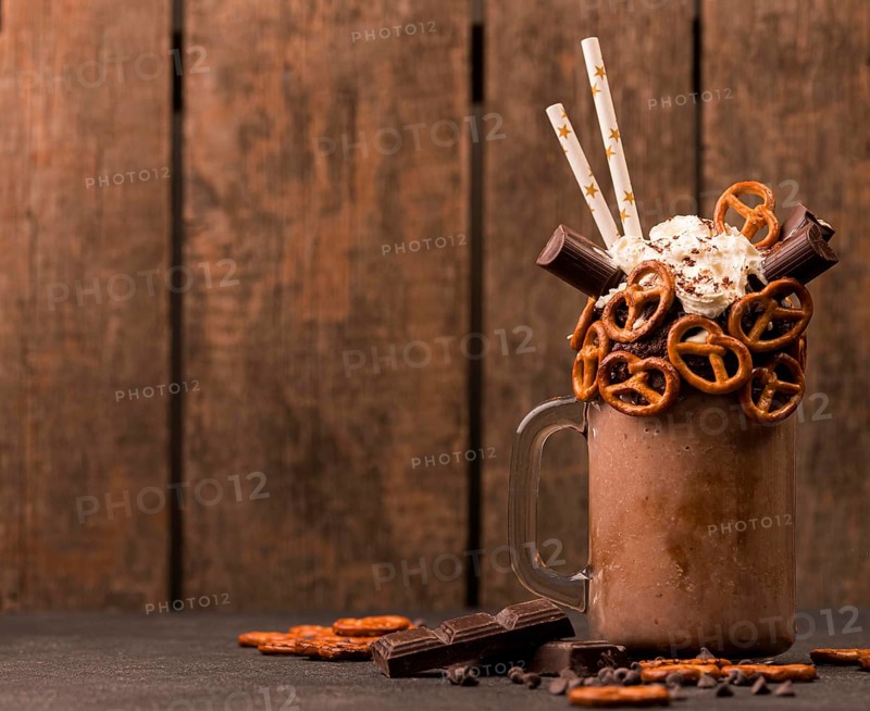 Front view chocolate milkshake with pretzels copy space