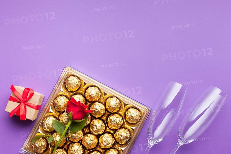 Flat lay frame with chocolate box gift