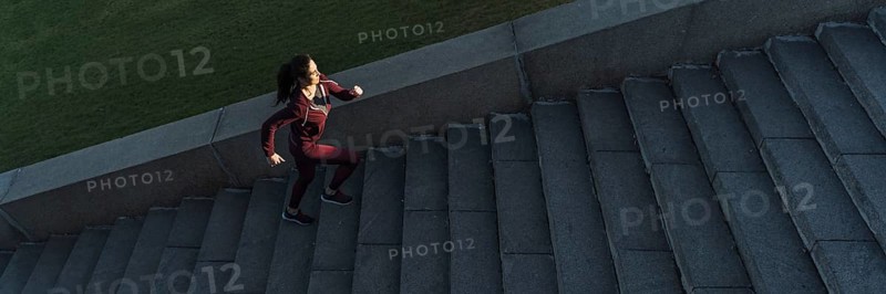 Fit young woman climbing stairs