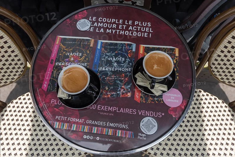 Two cups of coffee on a bistro table in a Paris cafe