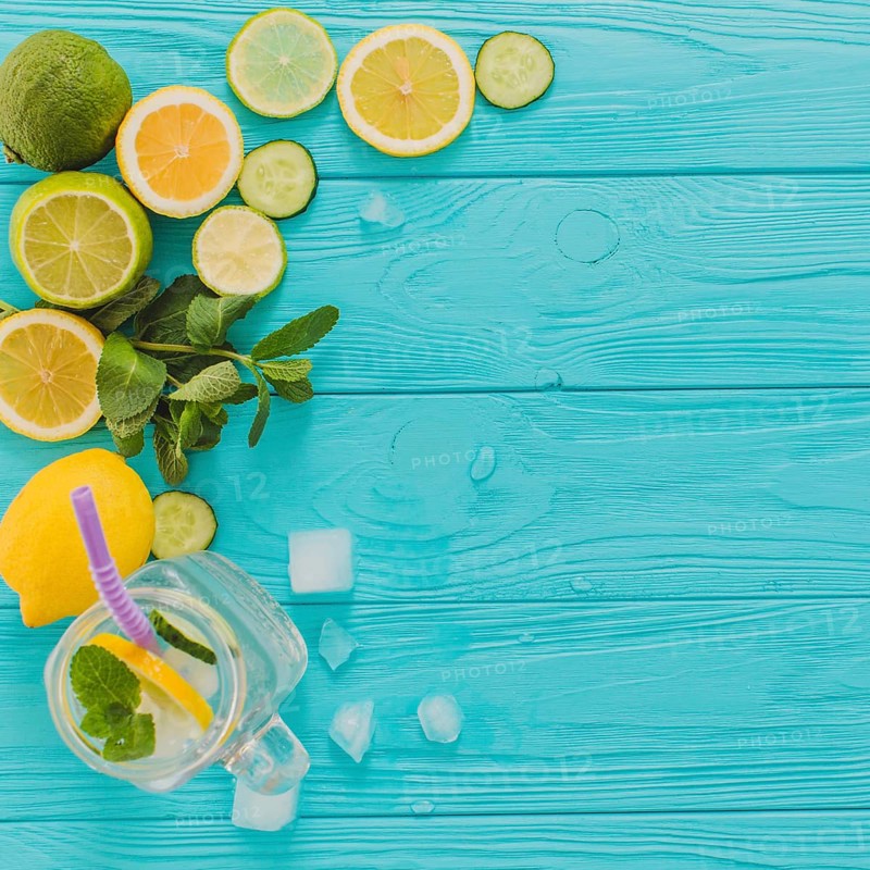 Blue wooden surface with lemons limes