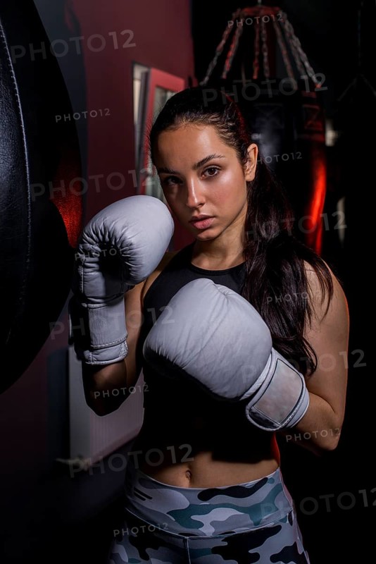 Boxer girl posing gym