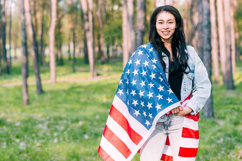 Young female covered with flag usa