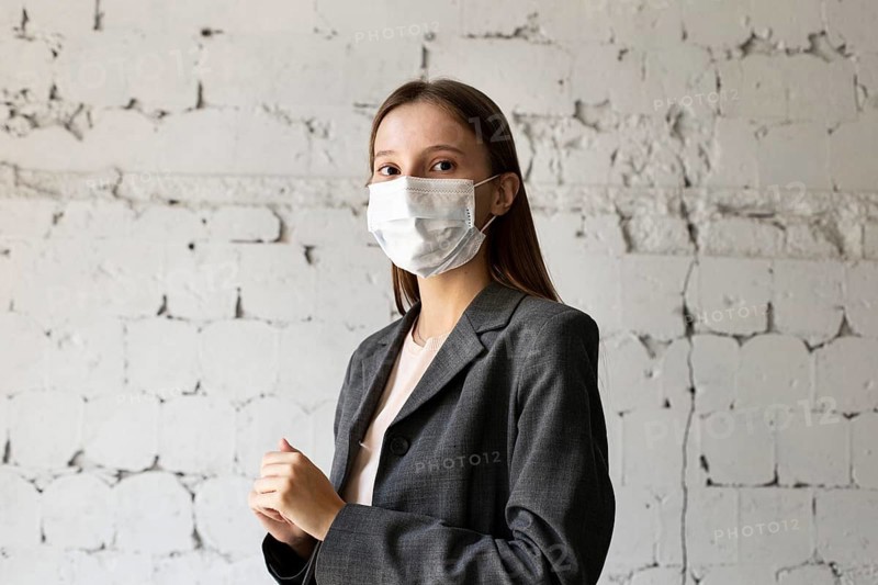 Portrait woman office with face mask