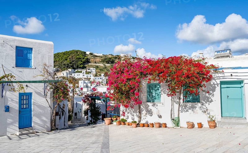White Cycladic house with turquoise windows and doors