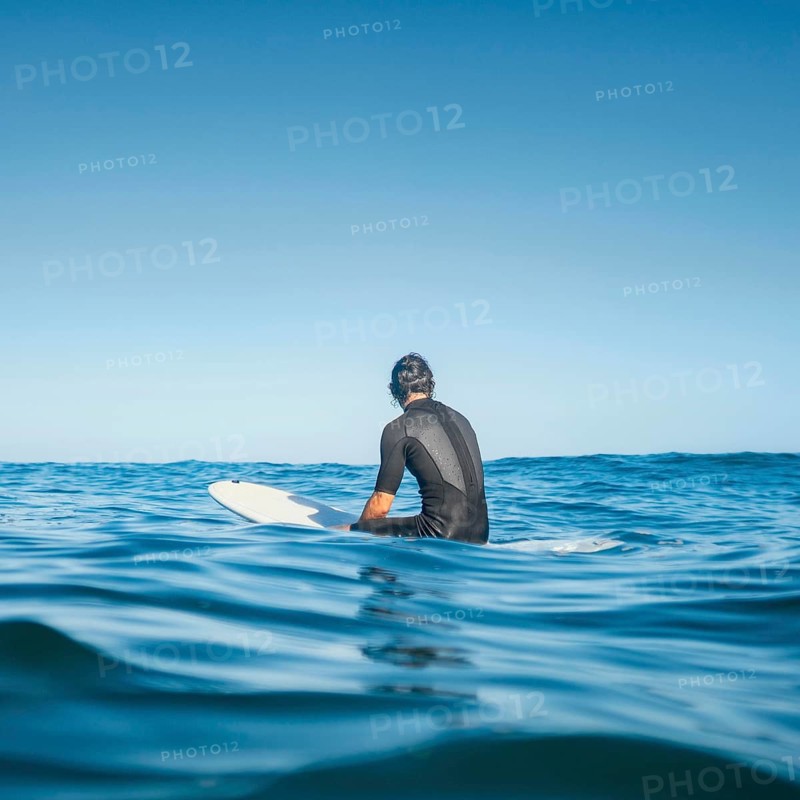 Man sitting water from