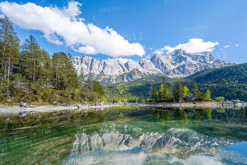Zugspitze massif and Zugspitze reflected in Eibsee lake