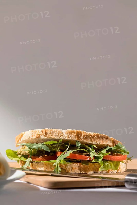 Front view toast sandwich with tomatoes greens copy space