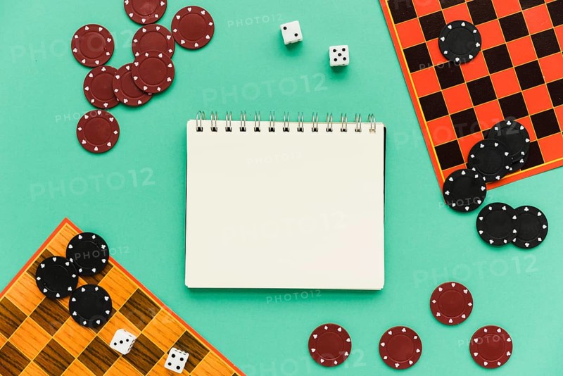 Top view society games with mock up notepad