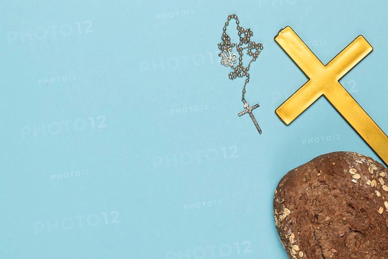 Copy space holy cross necklace with bread