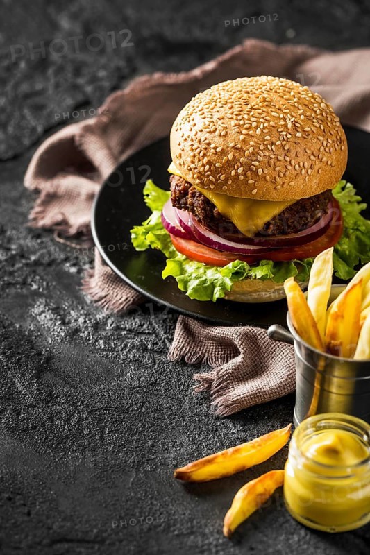 High angle fresh burger fries sauce