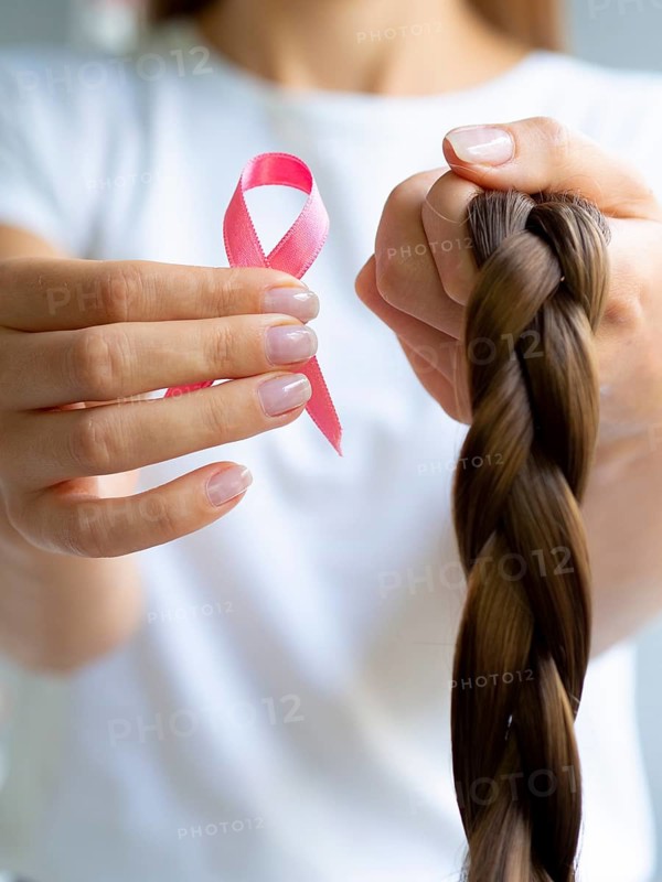 Girl holding up braid ribbon