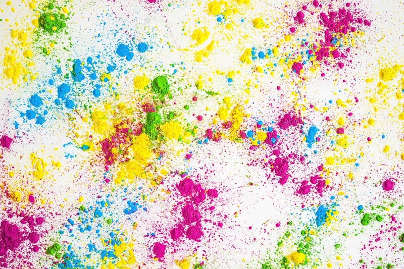 Multicolored powder splatter white background