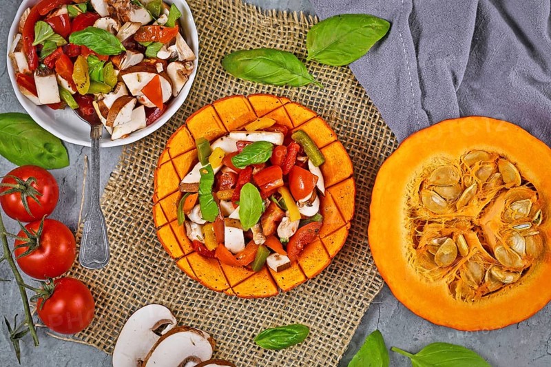 Vegan baked Red kuri squash vegetable filled with bell pepper