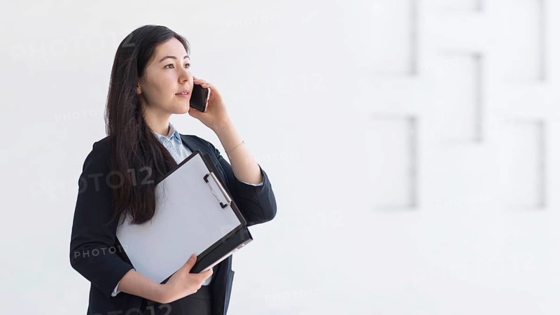 Side view woman with smartphone
