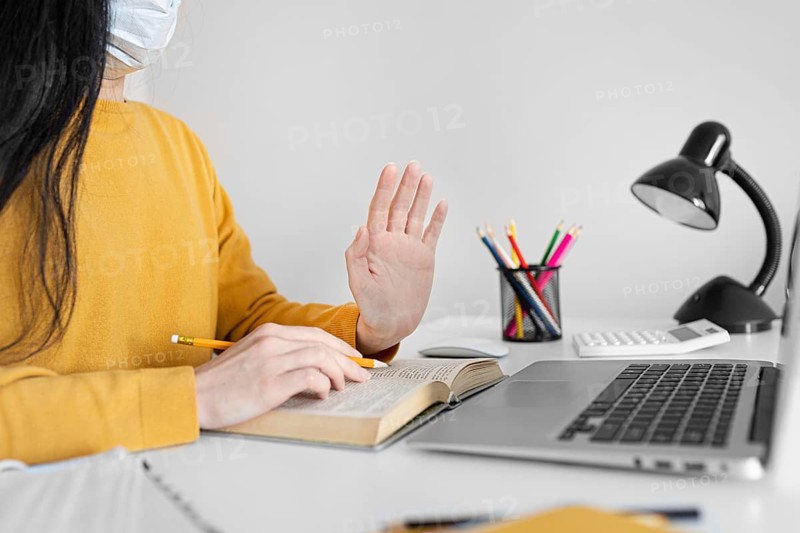 Close up student holding pencil