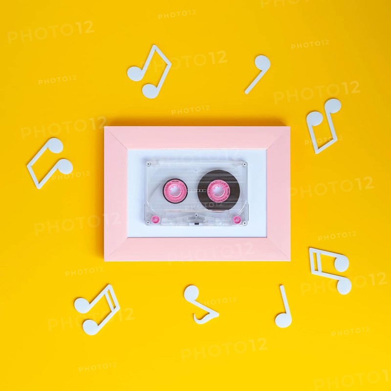 Bright colorful cassette tape with musical notes around it