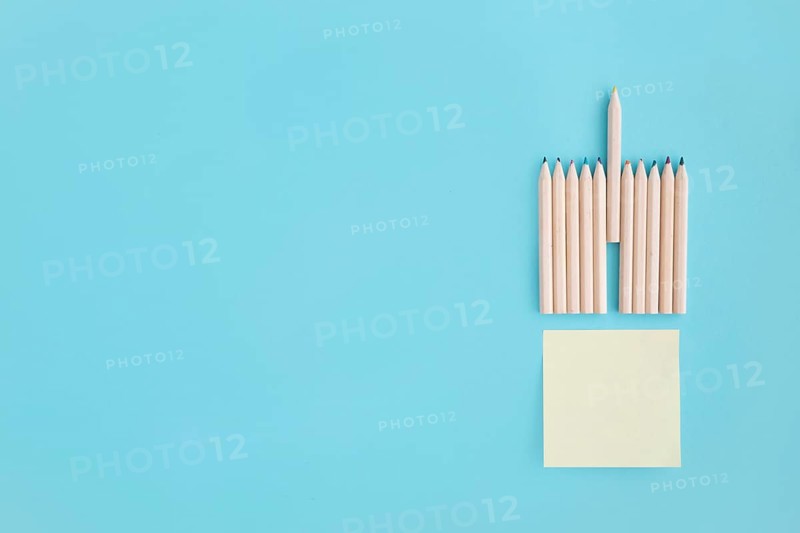 Blank sticky note with rows colored pencil blue background