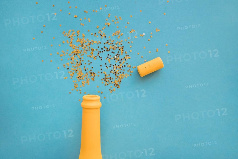 Spangles scattered from bottle table