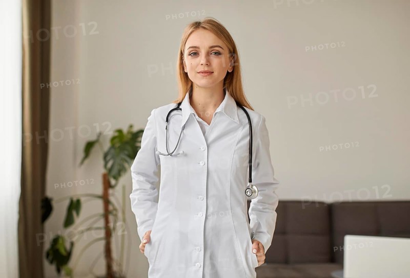 Front view covid recovery center female doctor with posing with stethoscope
