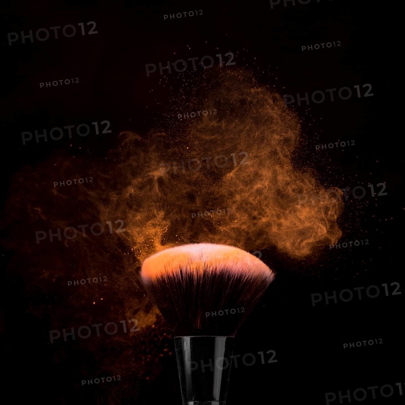 Brush makeup powder burst dark background