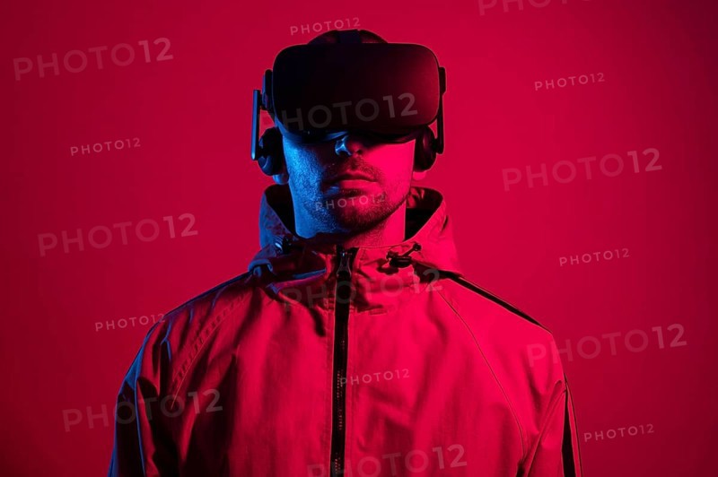 Man wearing virtual reality gadget with red light