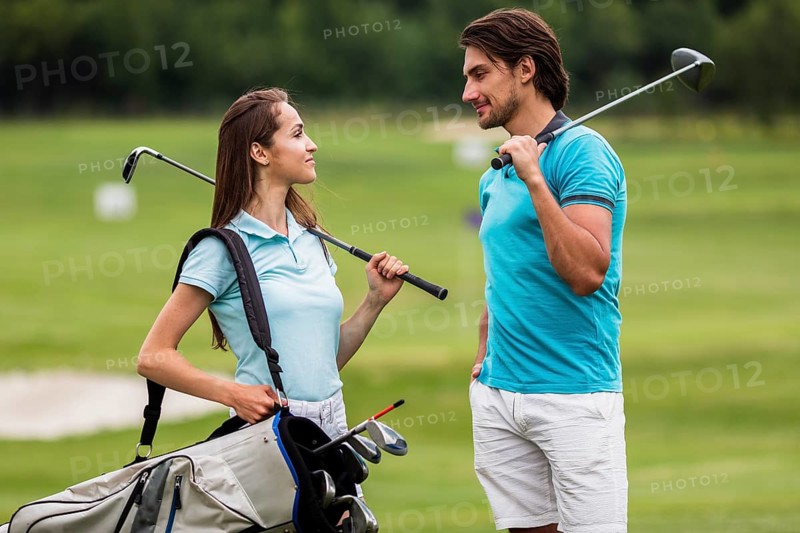 Front view fit friends playing golf