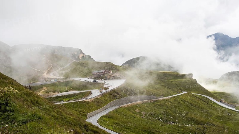Morning fog drifts over a mountain ridge