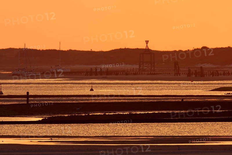 View from the island of Minsener Oog to Wangerooge at sunset