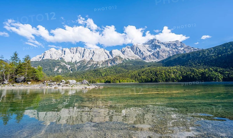 Zugspitze massif and Zugspitze reflected in Eibsee lake