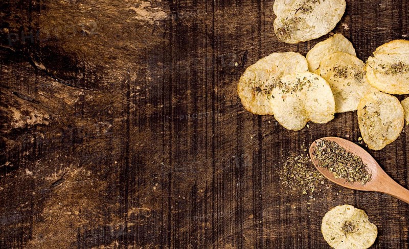 Top view potato chips with copy space spices