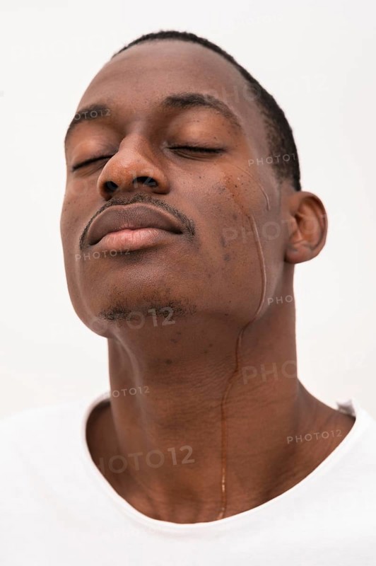 Front view black man crying