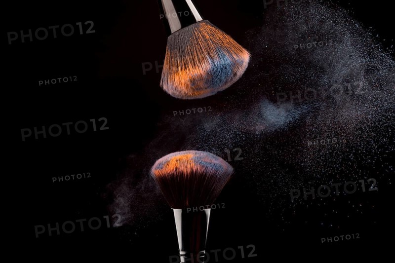 Cosmetic brushes with mist powder dark background