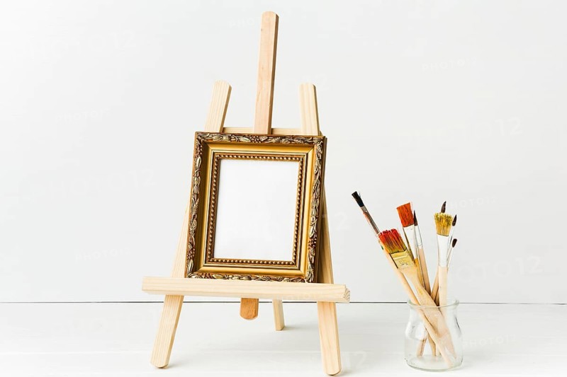 Front view minimalist frame easel brushes