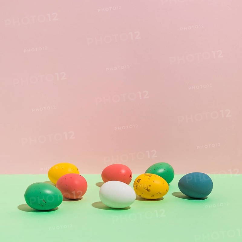 Small colorful easter eggs scattered table