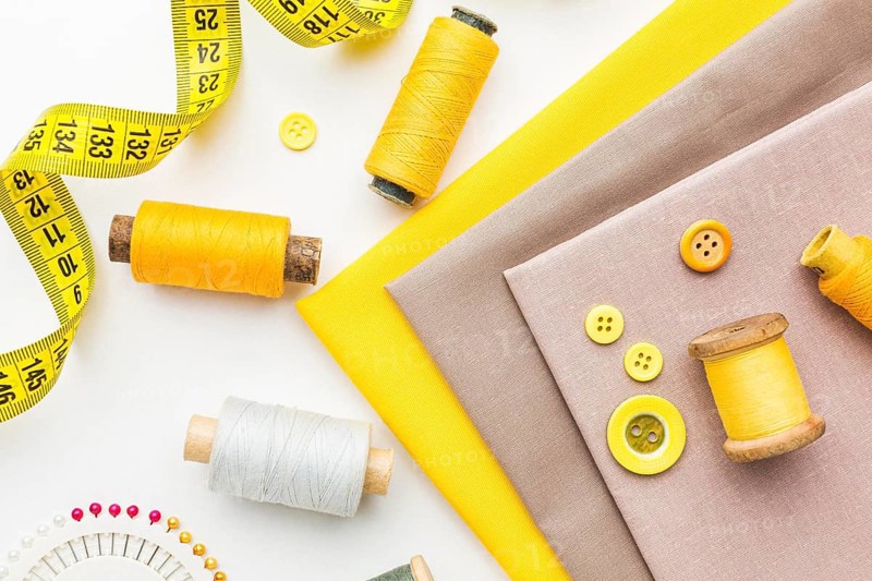 Top view fabrics with buttons measuring tape