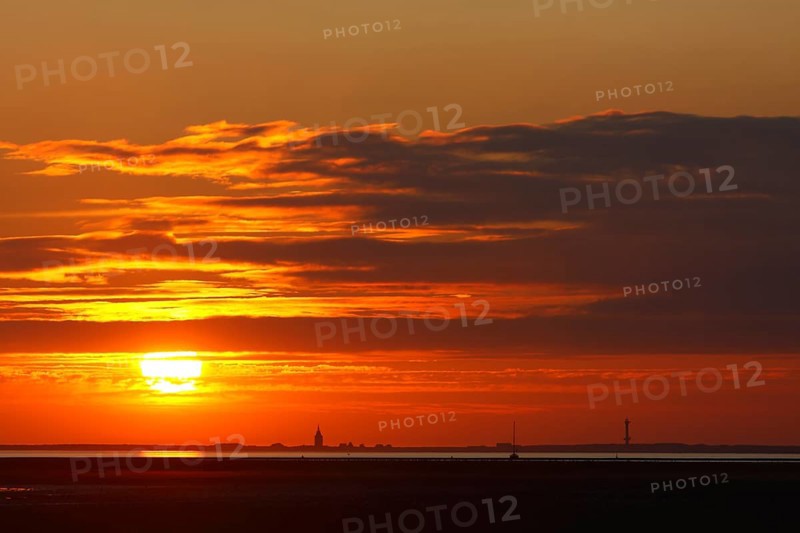 View from the island of Minsener Oog to Wangerooge at sunset