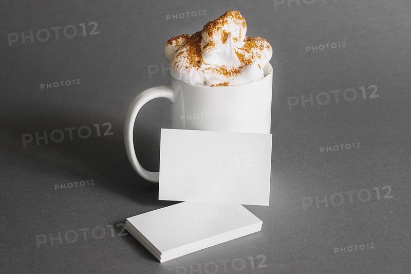 Stationery concept with business cards mug